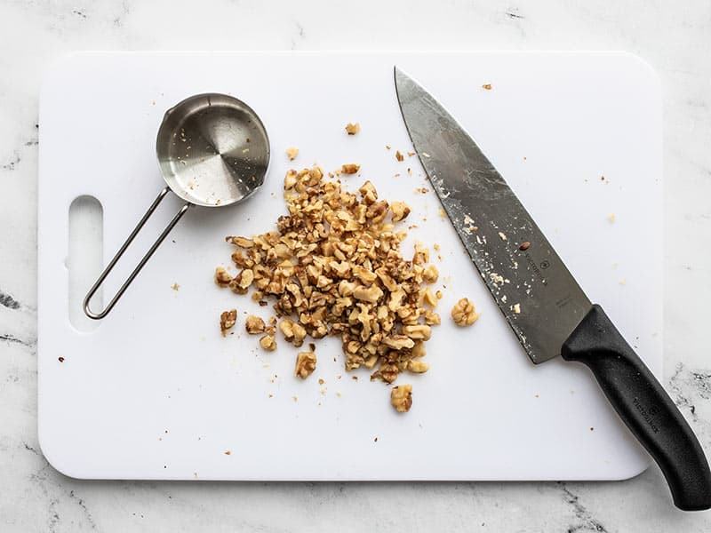 Chopped walnuts on a cutting board