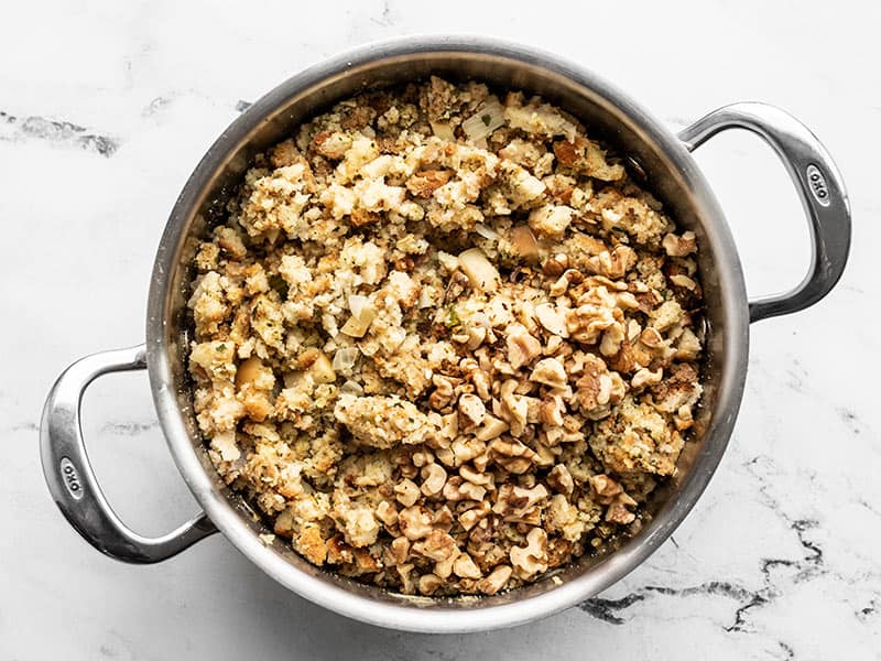 Chopped walnuts added to the pot with stuffing