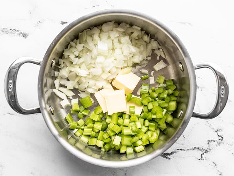 Diced onion, celery, and butter in a pot