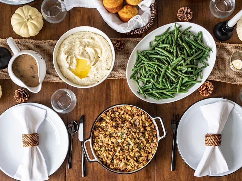 Thanksgiving side dishes on a dining table, from above