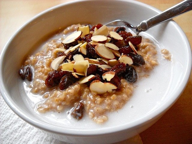 Bowl of Indian-style oats garnished with spices and milk.