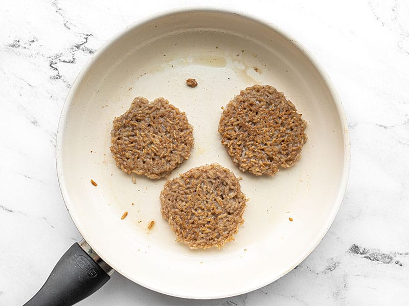 Cooked rice pancakes in the skillet