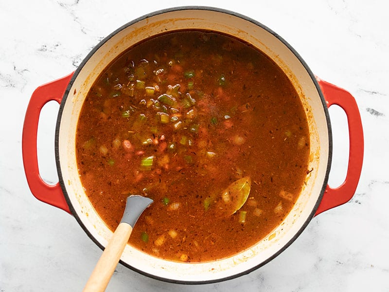 Stir red beans and spices before boiling