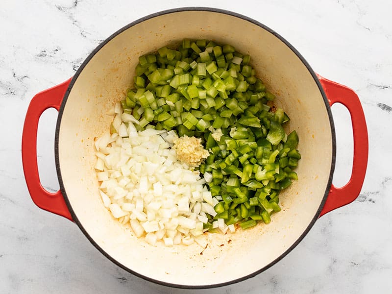 Onion, celery, bell pepper, garlic in the pot