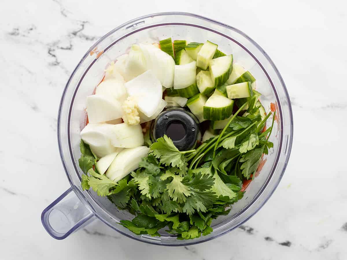 onion, cucumber, and herbs added to food processor