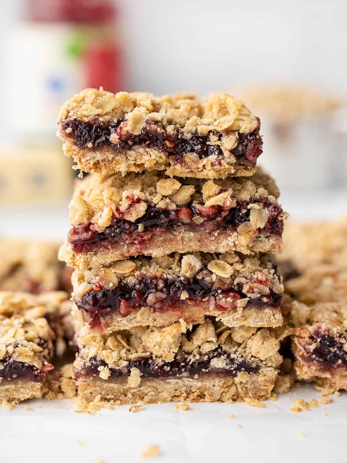 A stack of raspberry oatmeal bars viewed from the side