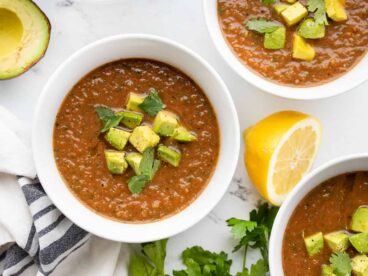 Overhead view of three bowls of summer gazpacho