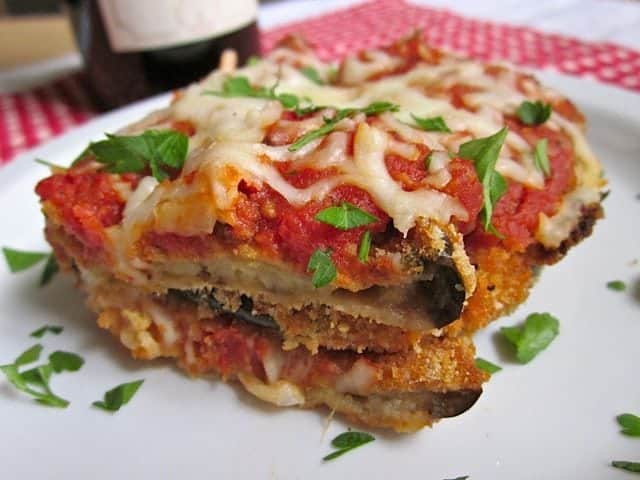 Close-up of eggplant parmesan with melted cheese.