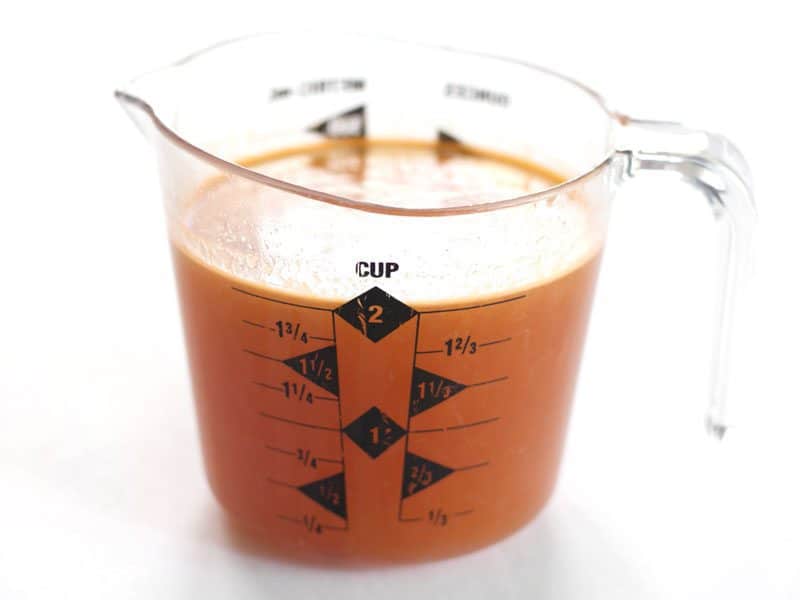 Prepared Vegetable Broth in measuring cup 