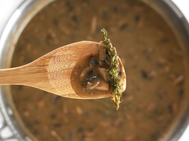 close up of spoonful of Thickened Mushroom Herb Gravy