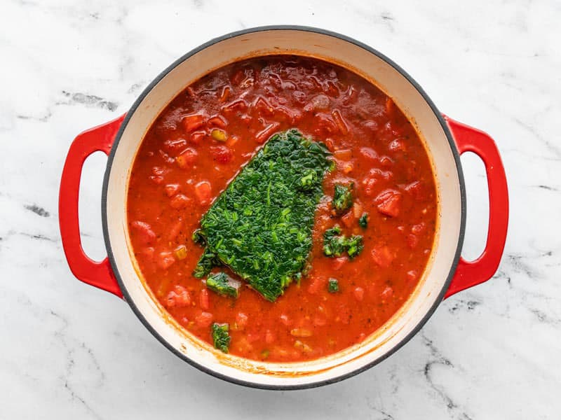 Simmered soup with frozen spinach added