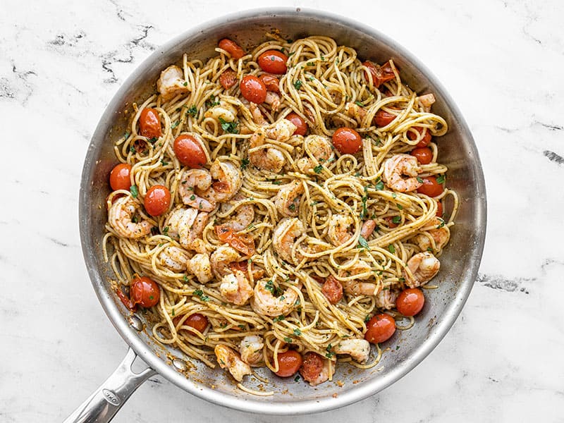 finished pesto shrimp pasta in the skillet