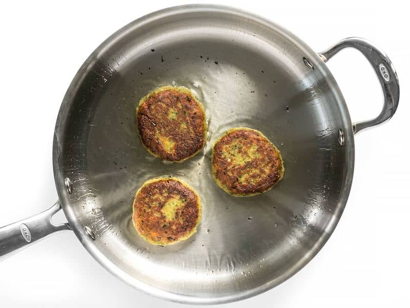 Top view of Three Falafel in pan frying 