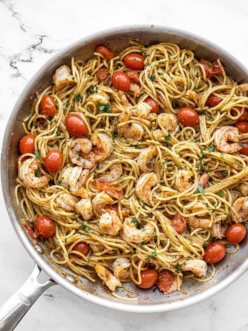 Overhead view of the skillet full of pesto shrimp pasta