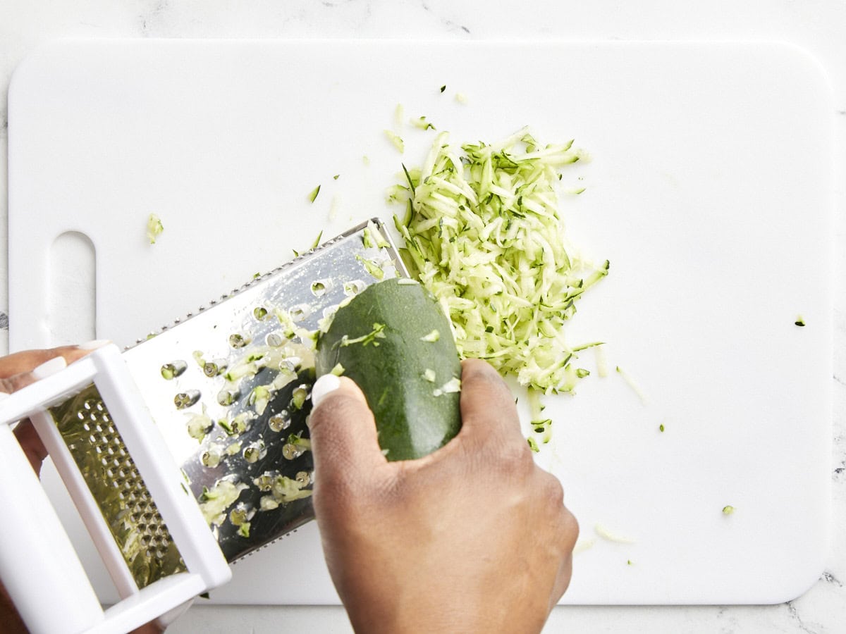 Zucchini being grated.