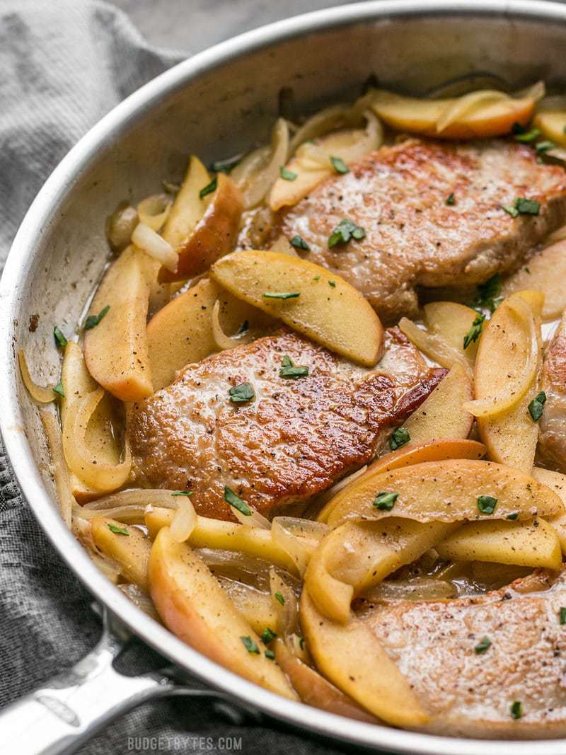 Close side view of Apple Spice Pork Chops in the skillet