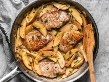 These Apple Spice Pork Chops are smothered with apples, onions, cinnamon, and butter which make a rich, flavorful, sweet, and savory main dish. BudgetBytes.com