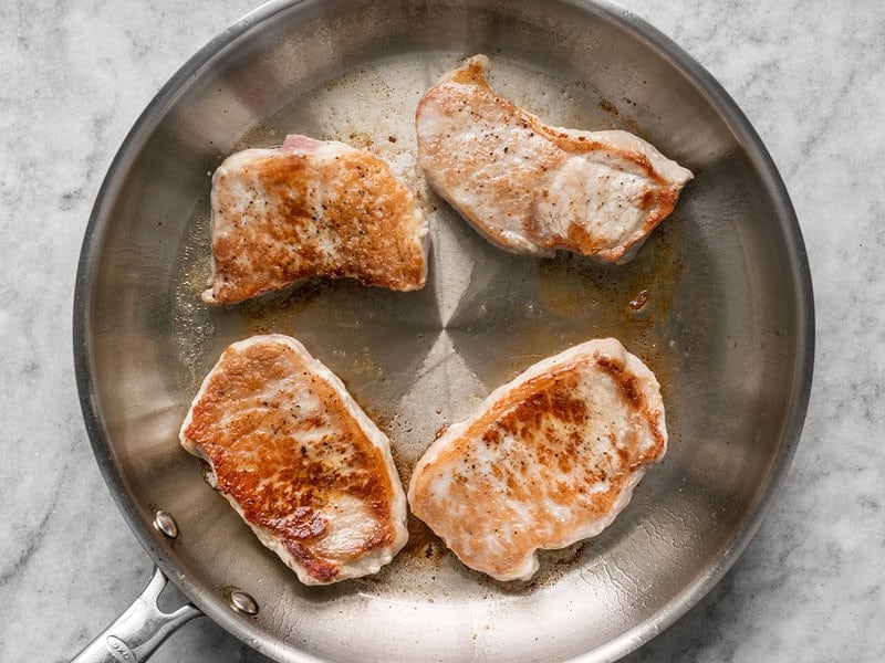 Browned Pork Chops in skillet