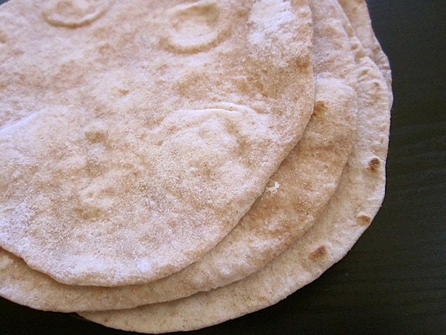 Low-fat flour tortillas stacked on a table.