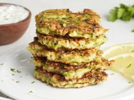 Front side view of a stack of zucchini fritters.