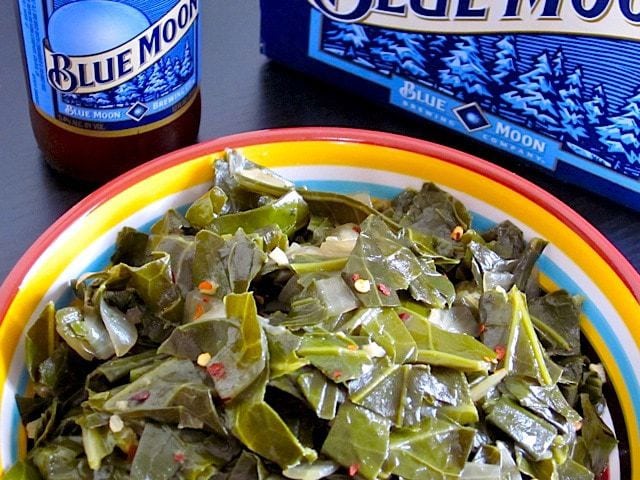 Beer-braised collards displayed on a plate.