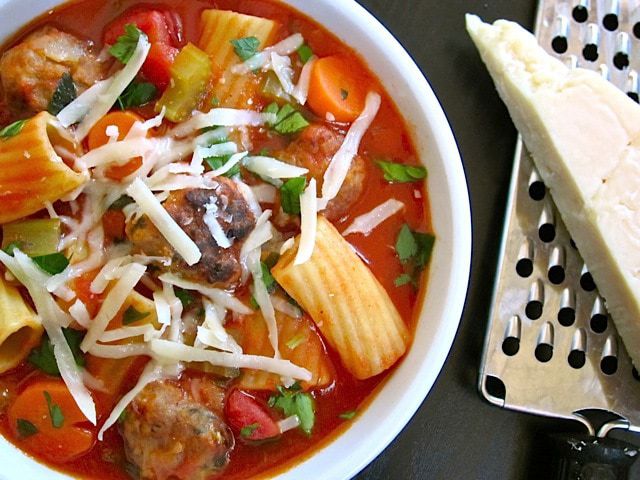 Close-up of meatball soup in a bowl.