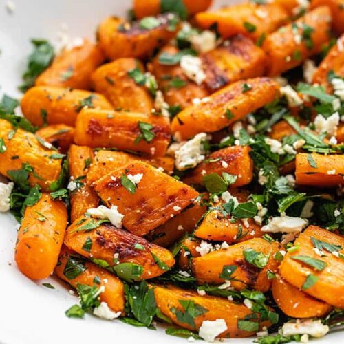 Close up side view of roasted carrot and feta salad