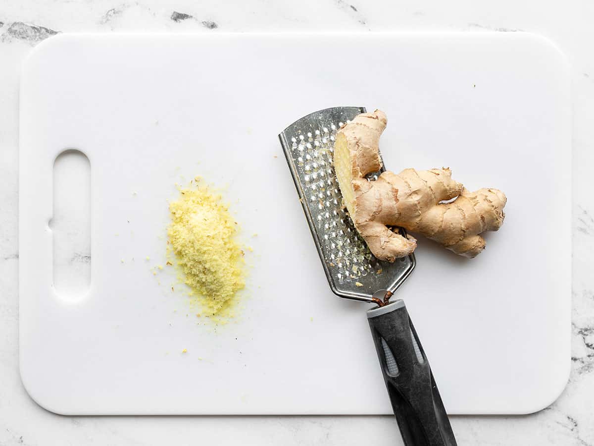 grated fresh ginger on a cutting board