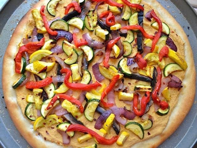 Hummus pizza displayed from above.