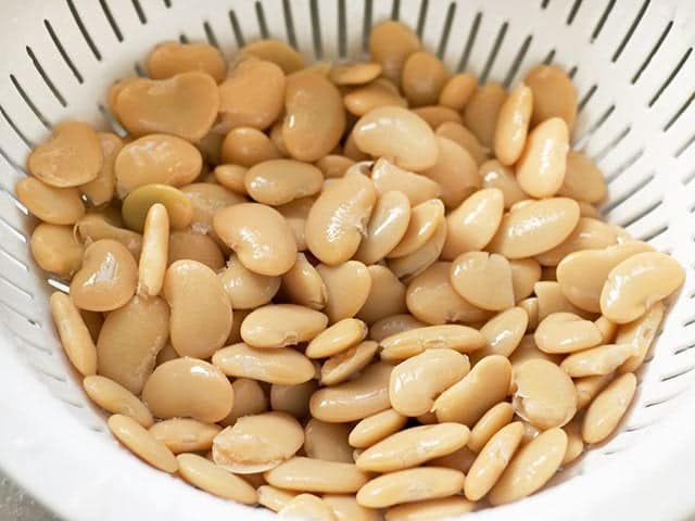 Butter Beans in strainer to rinse and drain 