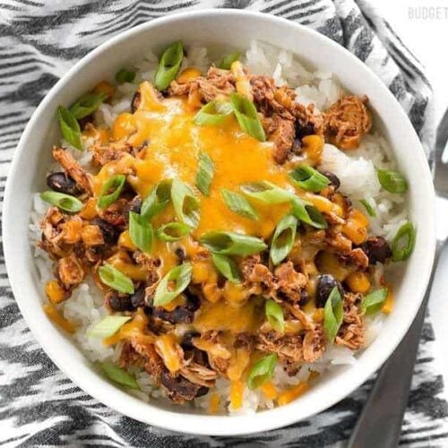 Taco chicken bowls with toppings above.