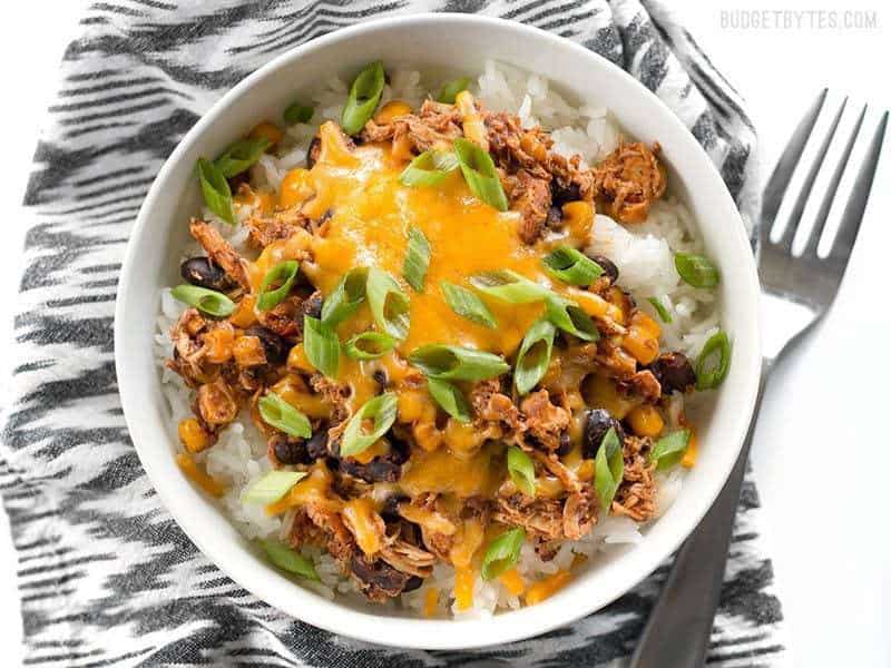 Taco chicken bowls with toppings above.