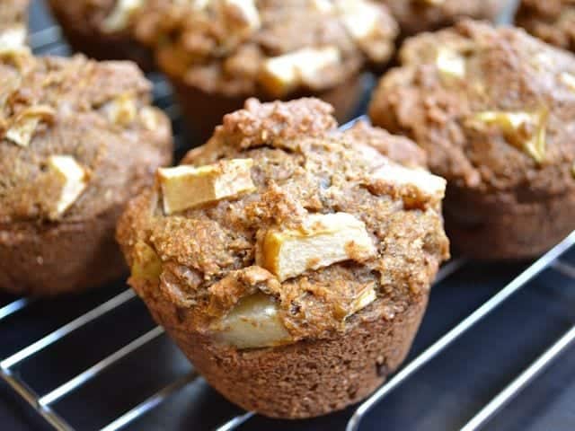 Apple flax muffins displayed on a rack.