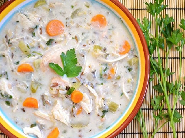 Close-up of chicken and rice soup in a bowl.