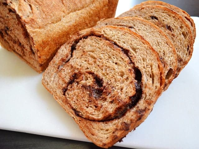 Chocolate cinnamon bread displayed on a serving plate.