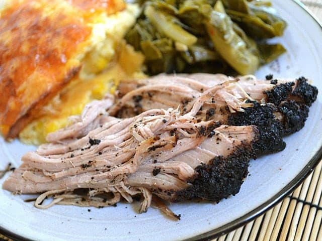 Coffee-rubbed pork served on a plate.