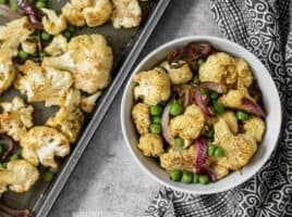 Add big flavor to plain cauliflower with this simple yet delicious Curry Roasted Cauliflower recipe. BudgetBytes.com