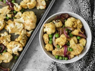 Add big flavor to plain cauliflower with this simple yet delicious Curry Roasted Cauliflower recipe. BudgetBytes.com