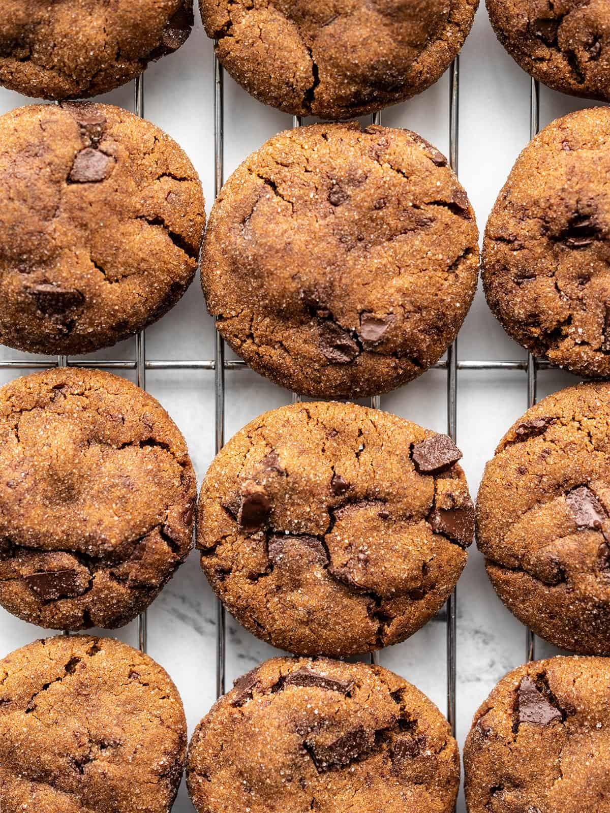 Close up of chocolate molasses cookies on a cooling rack