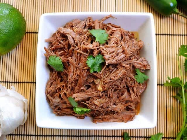 Shredded taco beef from above with coriander.