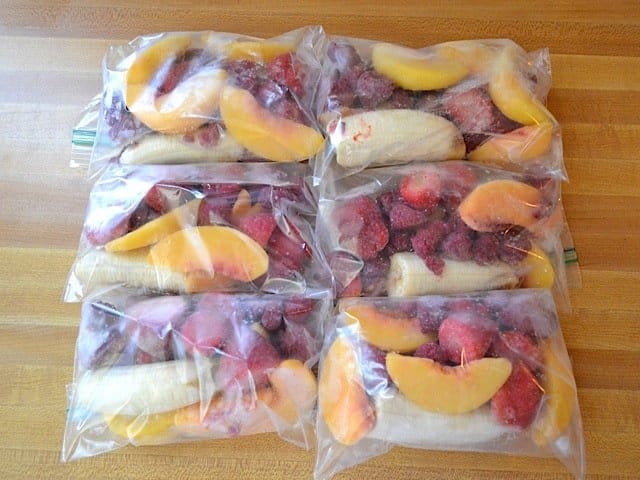 Smoothie packets displayed on a kitchen counter.