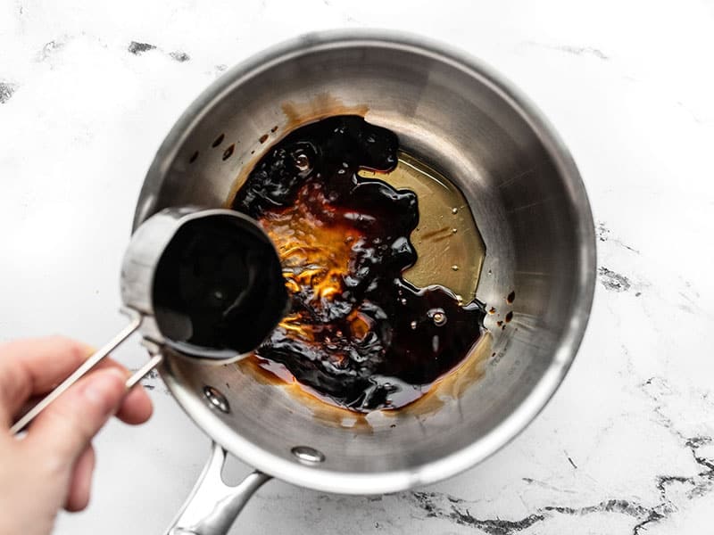 Balsamic vinegar and honey in a sauce pot