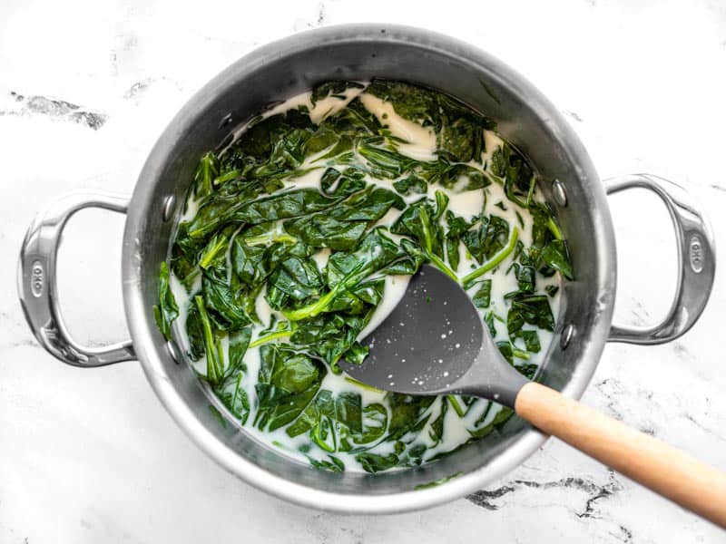 Wilted spinach in the coconut milk