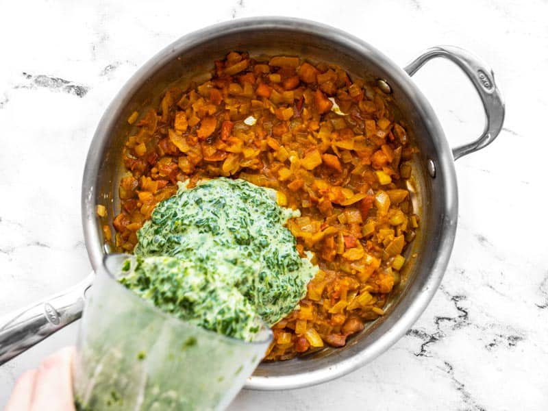 Pour coconut spinach into skillet