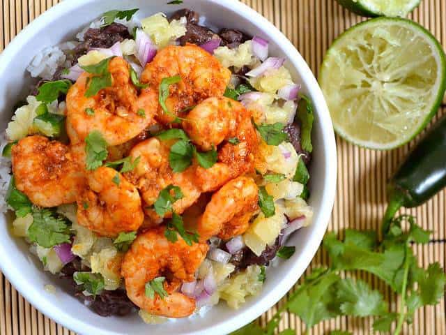 Chili lime shrimp served in a bowl with rice.