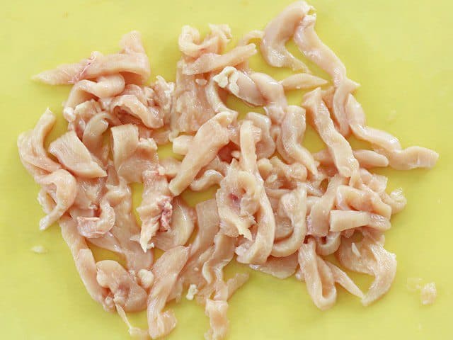 Sliced Raw Chicken on a cutting board