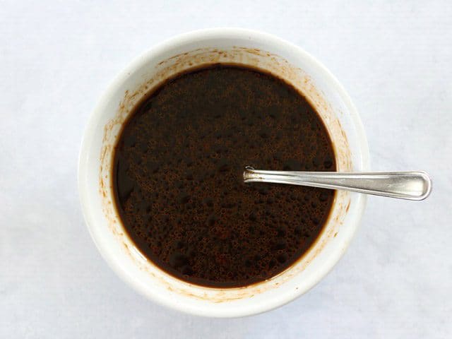 Yakisoba Sauce in a small white bowl with a spoon