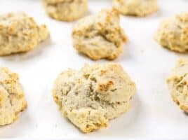 Front view of baked Rosemary Pepper Drop Biscuits on the baking sheet.