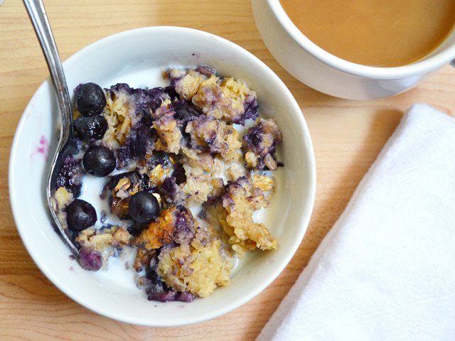 Blueberry banana oatmeal topped with fresh blueberries.