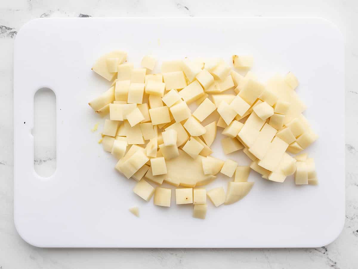 Cubed potato on a cutting board